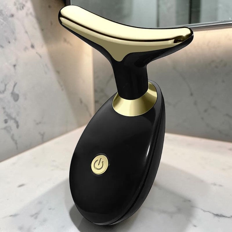 Dispositivo de masaje sónico zafiropulse PERENNE Sonic Lift en color negro y dorado para reafirmar el rostro y cuello