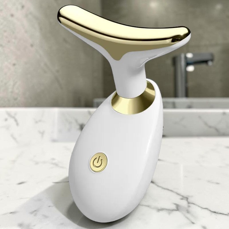 Dispositivo de masaje sónico PERENNE Sonic Lift de zafiropulse en color blanco y dorado para reafirmar el rostro