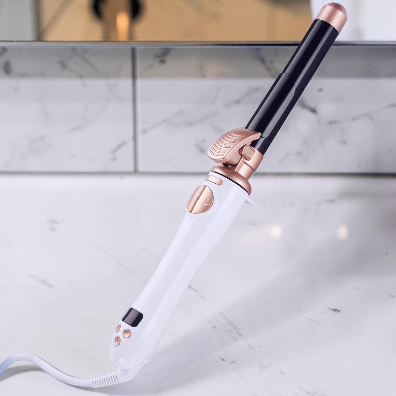 Rizador automático zafiropulse PERENNE Air-Wave Pro en color blanco y oro rosa sobre encimera de mármol