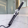 Rizador de pelo automático zafiropulse PERENNE Air-Wave Pro en color negro con detalles plateados y diseño ergonómico